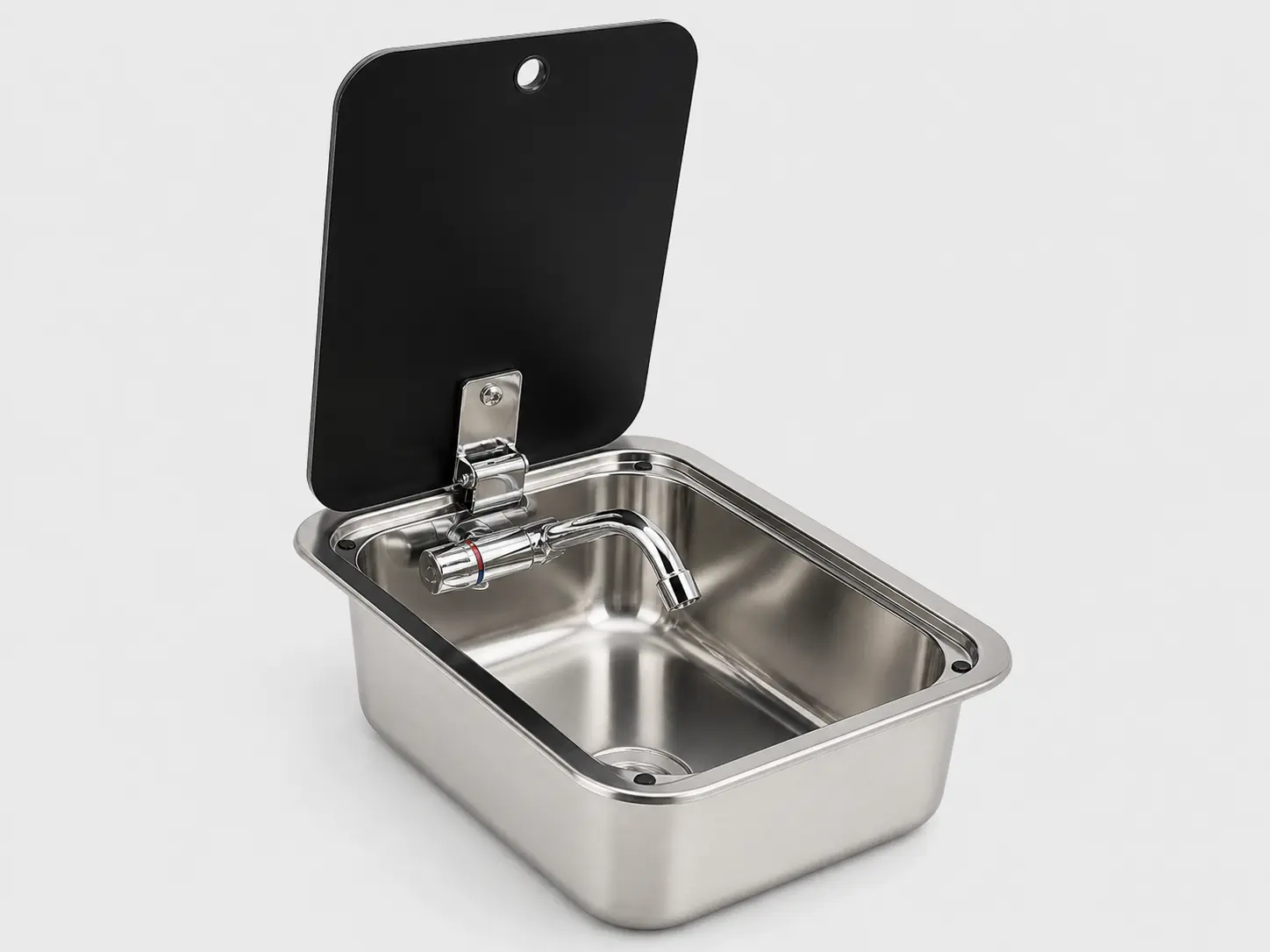 Compact stainless steel sink installed in an RV kitchen