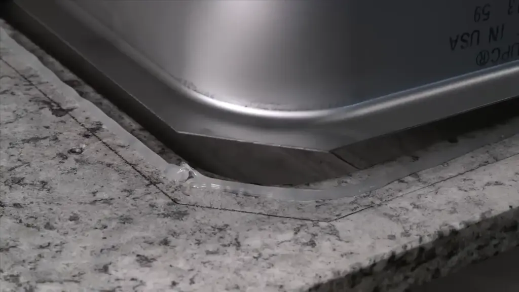 3.apply adhesive on the rim of sink