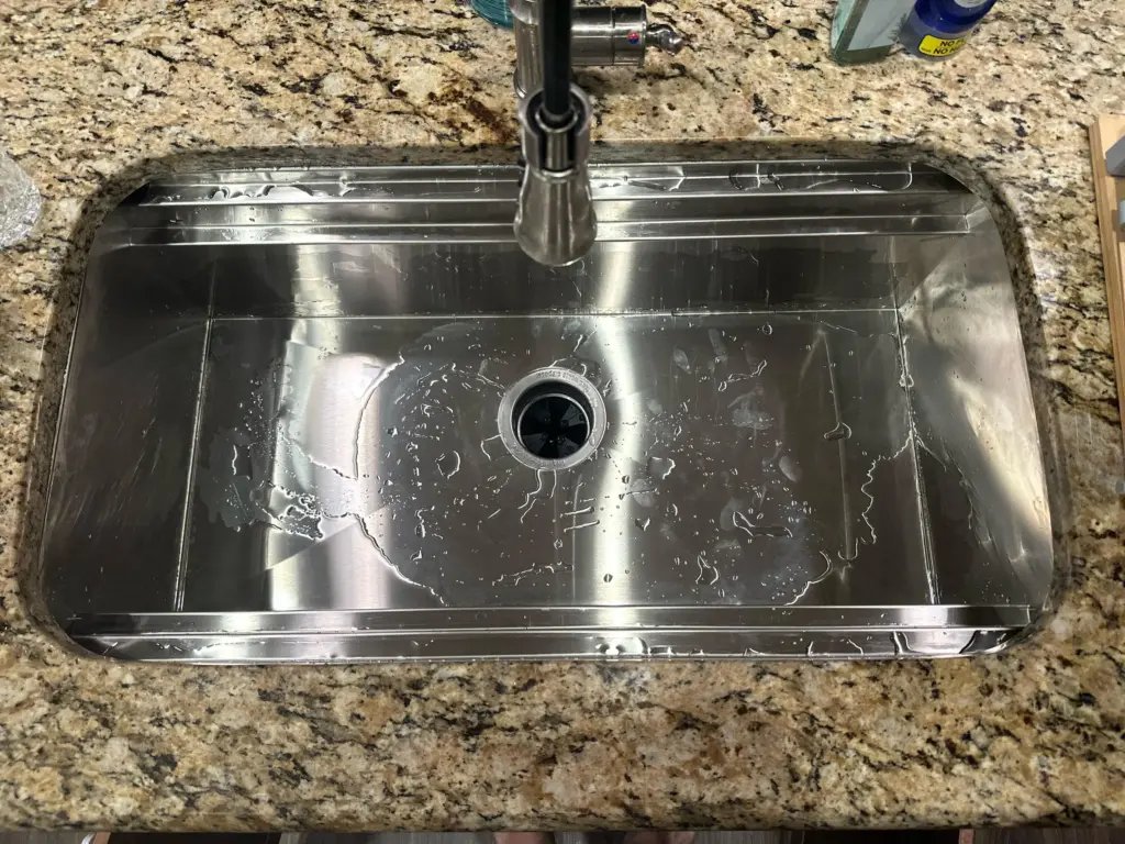 water pools in a kitchen sink