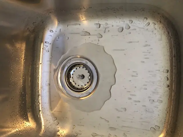why water pools in a kitchen sink